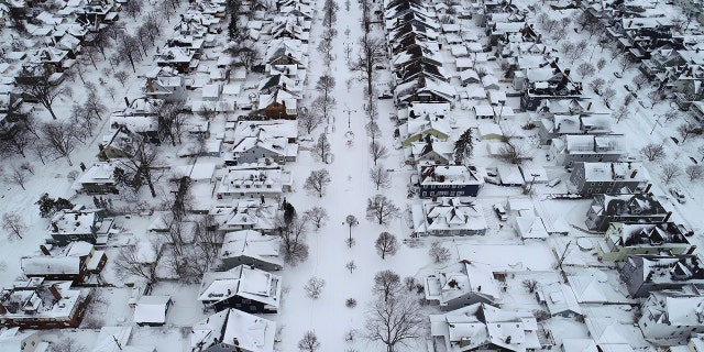 Fordham Avenue, center, and the 1901 Pan-American Exposition neighborhood of Buffalo, N.Y. is coated in a blanket of snow after the blizzard, Tuesday, Dec. 27, 2022. 