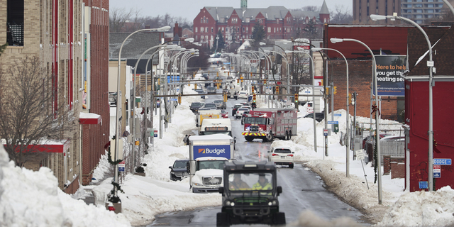 Vehicles drive down Jefferson Avenue in Buffalo. New York, on Wednesday, Dec. 28.