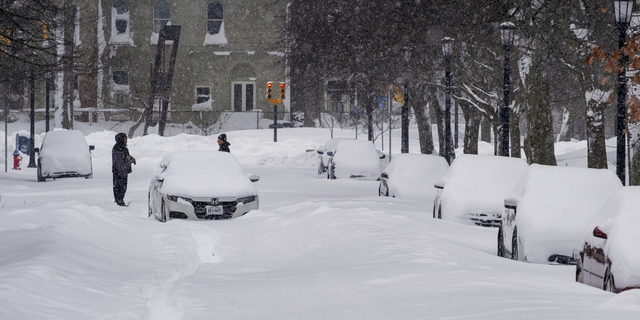 An abandoned car rests on a street in the Elmwood Village neighborhood of Buffalo, New York, on Monday.