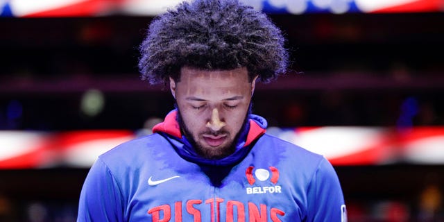 Cade Cunningham of the Detroit Pistons stands on the court for the national anthem before the game against the Cleveland Cavaliers on November 4, 2022, at Little Caesars Arena in Detroit.