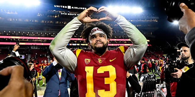 Quarterback Caleb Williams celebrates after USC defeated Notre Dame 38-27 at the Los Angeles Memorial Coliseum on Nov. 26, 2022.