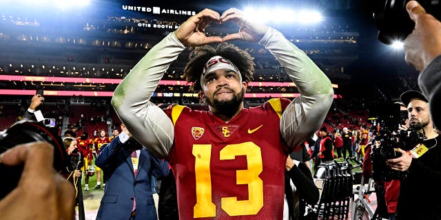 Quarterback Caleb Williams celebrates after USC defeated Notre Dame 38-27 at the Los Angeles Memorial Coliseum on November 26, 2022.