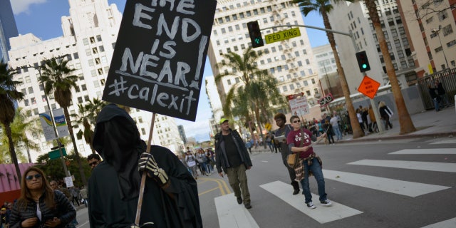 A demonstrator holds a "Calexit" sign during the Women's March in Los Angeles Jan. 21, 2017, in protest of former President Trump's inauguration. Professor Allen C. Guelzo, an award-winning historian of the Civil War era, noted secessionist proposals have lately emerged from both sides of the aisle.