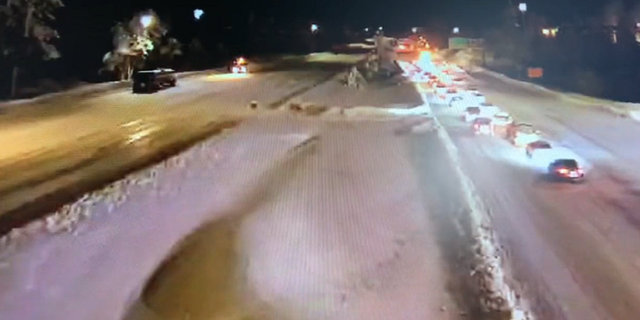 Cars move slowly on Sunday night along Interstate-80 in Northern California.