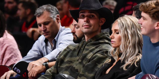 NHL goaltender Carey Price of the Montreal Canadiens takes in the atmosphere during the preseason NBA game between the Toronto Raptors and the Boston Celtics at Centre Bell on October 14, 2022, in Montreal, Quebec, Canada.