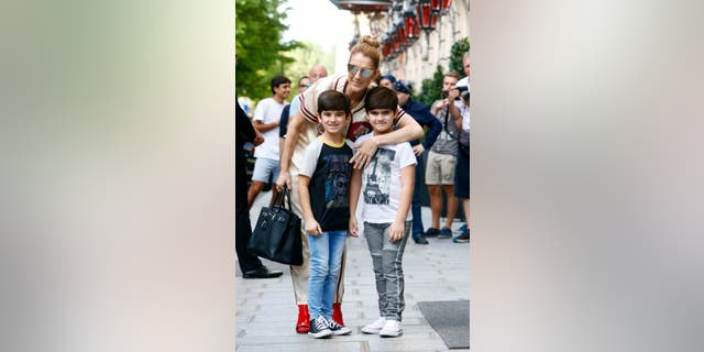 Celine Dion pictured with her twins in 2017.