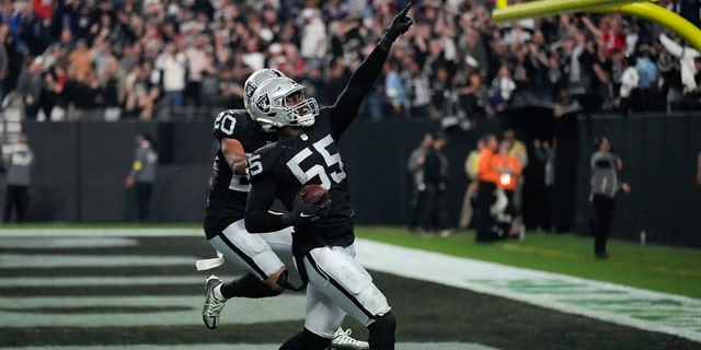 Las Vegas Raiders defensive end Chandler Jones celebrates after scoring on an interception during the second half of an NFL football game between the New England Patriots and the Las Vegas Raiders on Sunday, Dec. 18, 2022, in Las Vegas. 