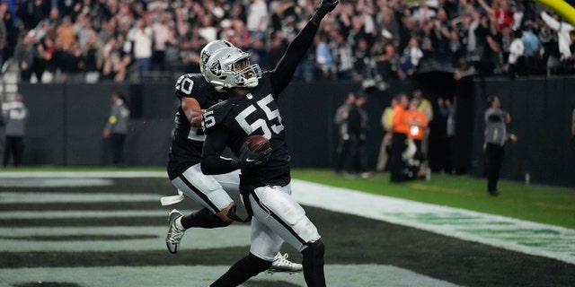 Las Vegas Raiders defensive end Chandler Jones celebrates after scoring on an interception during the second half of an NFL football game between the New England Patriots and Las Vegas Raiders, Sunday, Dec. 18, 2022, in Las Vegas. 