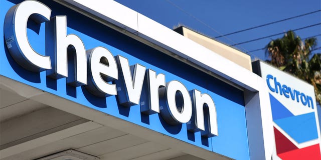 The Chevron logo is displayed at a Chevron gas station on October 28, 2022 in Los Angeles, California. Chevron posted near record profits as their quarterly profit rose 84 percent to $11.23 billion amid a surge in oil prices during the quarter. (Photo by Mario Tama/Getty Images)