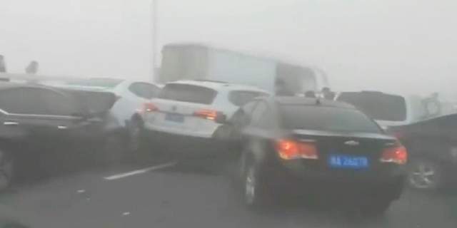 A massive crash in Zhengzhou, China, during foggy conditions Wednesday, has been captured on video.
