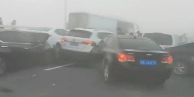 A massive crash in Zhengzhou, China, during foggy conditions Wednesday, has been captured on video.