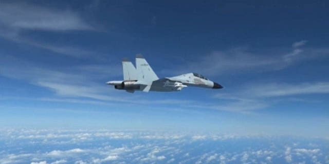 Footage of a Chinese pilot flies a jet just 10-feet away from a U.S. Airforce RC-135 plane on Dec. 21. (Credit: Department of Defense)