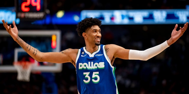 Dallas Mavericks forward Christian Wood (35) gets the crowd energized in the second half of an NBA basketball game against the Los Angeles Lakers in Dallas, Sunday, Dec. 25, 2022.
