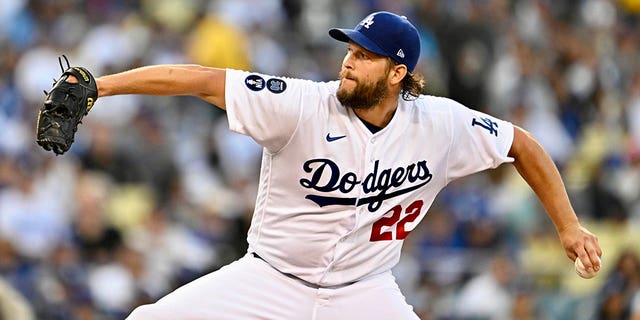 Clayton Kershaw of the Los Angeles Dodgers throws to the plate against the San Diego Padres in the first inning of Game 2 of a National League Division Series at Dodger Stadium in Los Angeles on October 12, 2022.