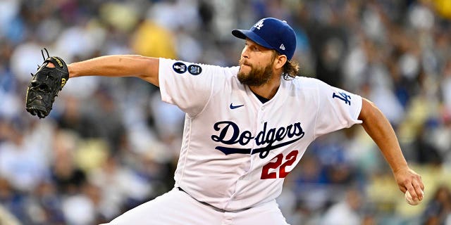 Clayton Kershaw of the Los Angeles Dodgers throws to the plate against the San Diego Padres in the first inning of Game 2 of a National League Division Series at Dodger Stadium in Los Angeles on October 12, 2022.