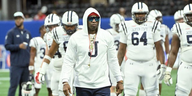 Jackson State Tigers Head Coach Deion Sanders walks the field during pregame warmups prior to the Cricket Celebration Bowl against the North Carolina Central Eagles at Mercedes-Benz Stadium on December 17, 2022 in Atlanta, Georgia.
