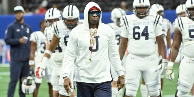 Head coach Deion Sanders of the Jackson State Tigers walks the field during pregame warmups prior to the Cricket Celebration Bowl against the North Carolina Central Eagles at Mercedes-Benz Stadium on December 17, 2022 in Atlanta, Georgia.