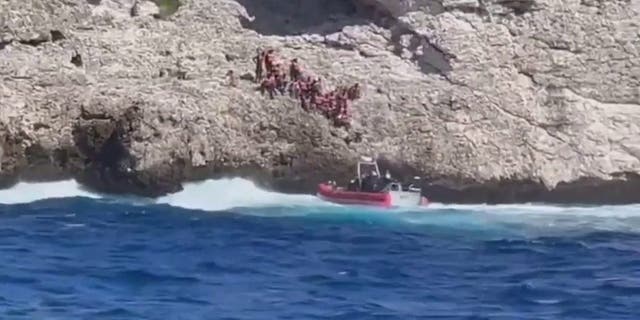 A small U.S. Coast Guard boat launched from cutter Heriberto Hernandez rescues migrants abandoned by smugglers.