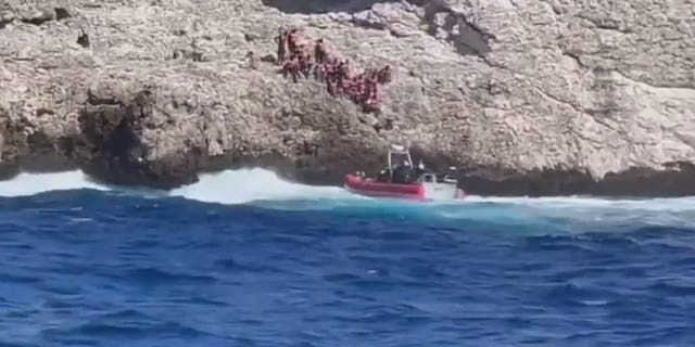 A small U.S. Coast Guard boat launched from cutter Heriberto Hernandez rescues migrants abandoned by smugglers.