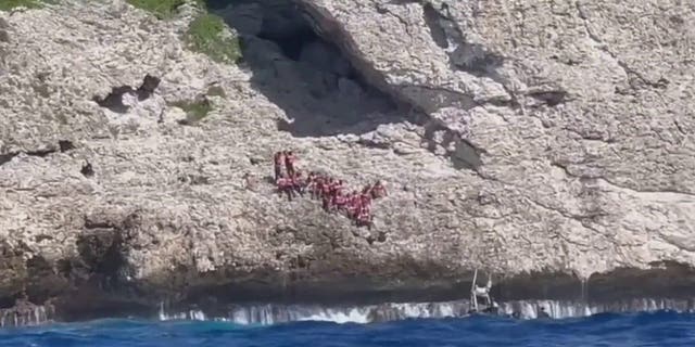 The U.S. Coast Guard rescues 34 Haitians abandoned by smugglers in Puerto Rico.