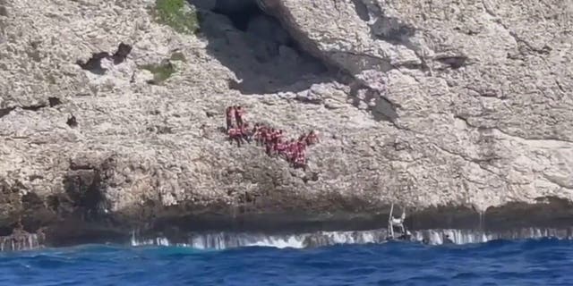 Coast Guard rescues 34 Haitians dumped by smugglers on Puerto Rico cliff 2 The U.S. Coast Guard rescues 34 Haitians abandoned by smugglers in Puerto Rico.