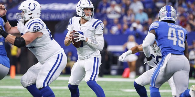 Nick Foles of the Colts drops back to pass against the Detroit Lions at Lucas Oil Stadium on Aug. 20, 2022, in Indianapolis.
