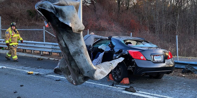 The driver of this car survived after their car was impaled by a guardrail during a crash in Manchester, Connecticut, on Dec. 26.