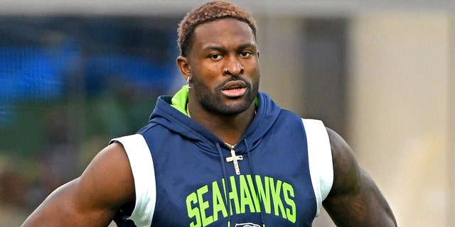 Seattle Seahawks wide receiver DK Metcalf, #14, warms up prior to the game against the Los Angeles Chargers at SoFi Stadium in Inglewood, California, Oct. 23, 2022.