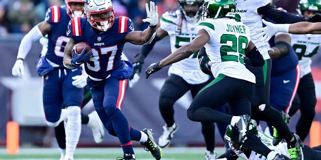 Damien Harris #37 of the New England Patriots carries the ball against the New York Jets during the first quarter at Gillette Stadium on November 20, 2022, in Foxborough, Massachusetts. 