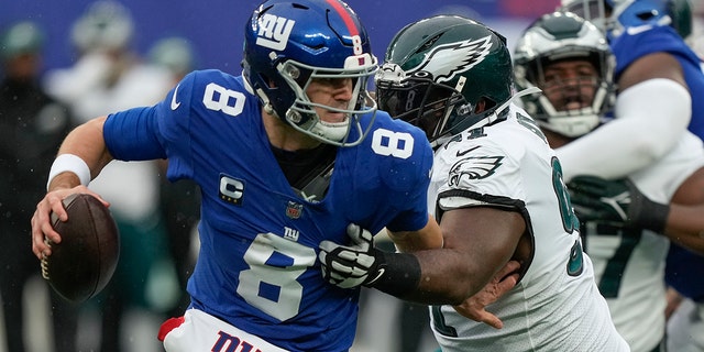 New York Giants quarterback Daniel Jones (8) is pressured by Philadelphia Eagles defensive tackle Fletcher Cox (91) during the second quarter of a game on Sunday, Dec. 11, 2022 in East Rutherford, NJ. 