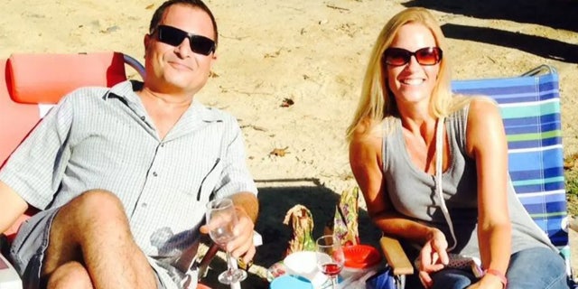 David and Marylue Wigglesworth lounging on a beach in an undated photo. Marylue is accused of fatally shooting him on Christmas during a fight.