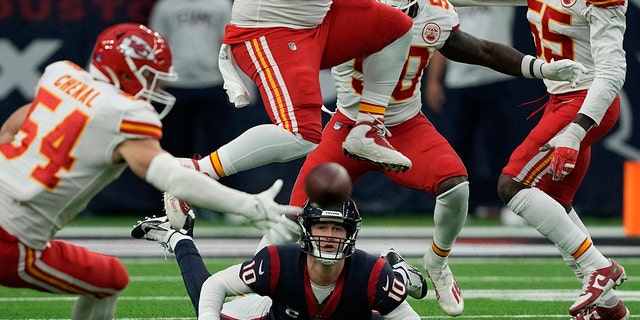 Houston Texans quarterback Davis Mills (10) fumble the ball during overtime in an NFL football game against the Kansas City Chiefs Sunday, Dec. 18, 2022, in Houston. Kansas City Chiefs recovered the ball.