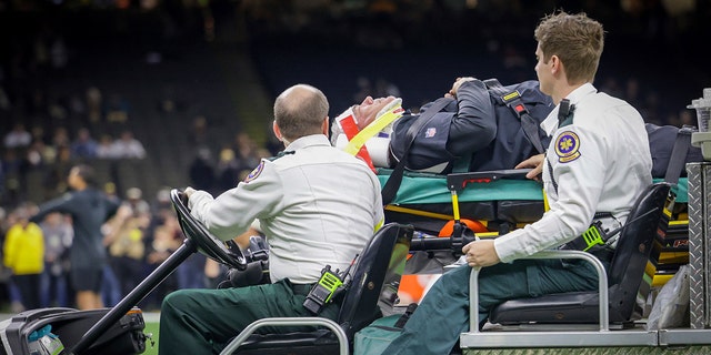 Atlanta Falcons defensive coordinator Dean Pees is carted off the field shortly before the Saints game in New Orleans on Sunday, Dec. 18, 2022.