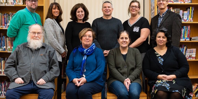 A 2018 photo of the Dedham Human Rights Commission, in which Loud is pictured in the front row, third from left.