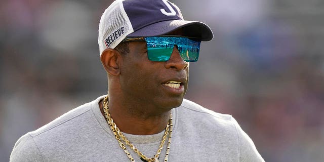 Jackson State head coach Deion Sanders surveys his players during warmups prior to the Southwestern Athletic Conference championship game against Southern University, Saturday, Dec. 3, 2022, in Jackson, Mississippi.