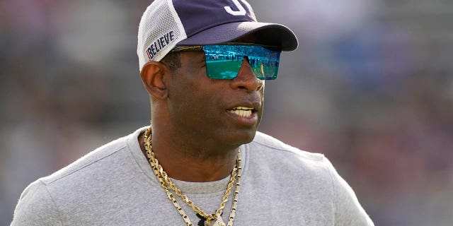 Jackson State head coach Deion Sanders surveys his players during warmups prior to the Southwestern Athletic Conference championship game against Southern University, Saturday, Dec. 3, 2022, in Jackson, Mississippi.