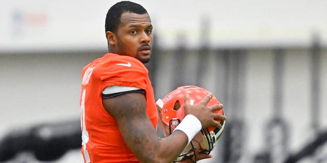 Cleveland Browns quarterback Deshaun Watson stands on the field during an NFL football practice at the team's training facility on Wednesday, Nov. 30, 2022, in Berea, Ohio.