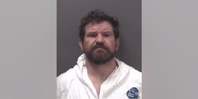Ewen Dewitt, 42, allegedly attacked a woman with axed Tuesday, killing her, police said.