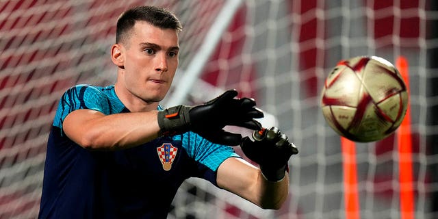 Croatia's goalkeeper Dominik Livakovic catches the ball during the training session on the eve of the 2022 World Cup semifinal soccer match between Croatia and Argentina in Doha, Monday, Dec. 12, 2022. 