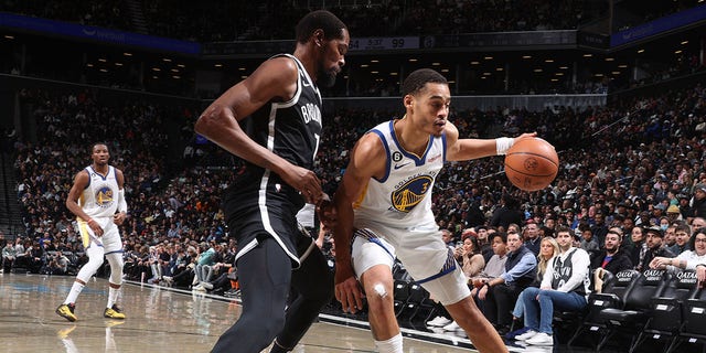 Jordan Poole (3) of the Golden State Warriors dribbles the ball during a game against the Brooklyn Nets Dec. 21, 2022, at Barclays Center in Brooklyn, N.Y.