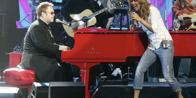 Sir Elton John and Celine Dion perform together during the Harrah's Entertainment Artists Rally Together (H.E.A.R.T.) benefit concert at The Colosseum at Caesars Palace February 20, 2006 in Las Vegas, Nevada.