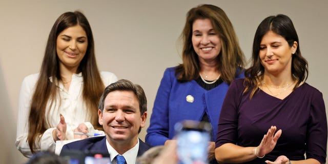 Governor Ron DeSantis looks up after signing a bill reducing tolls for commuters during a news conference held at the Florida Department of Transportation offices in Ft. Lauderdale, FL, on Dec. 15, 2022.