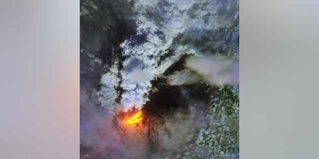 The European Space Agency's Copernicus Sentinel-2 satellite on Nov. 28, 2022, captured a view of the Mauna Loa eruption that uses infrared data to emphasize the lava. 