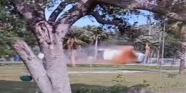 Cooking oil is seen flying into the air as a truck crashed Thursday in Fort Myers, Florida.