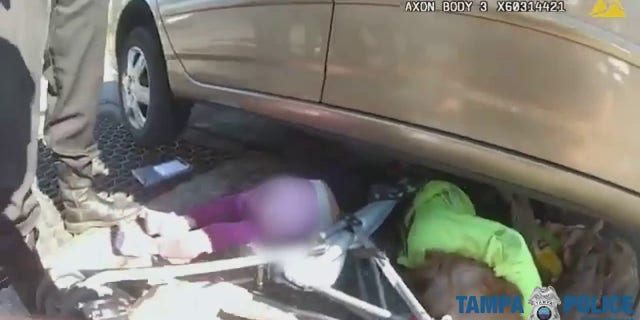 Police cut the child out from the straps in the stroller and pulled her free.