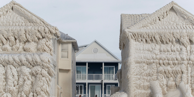 The homes were covered in ice from the ground to their roofs.