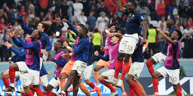 France's players celebrate their victory in a Qatar 2022 World Cup semifinal match against Morocco at the Al-Bayt Stadium in Al Khor, north of Doha, Dec. 14, 2022.