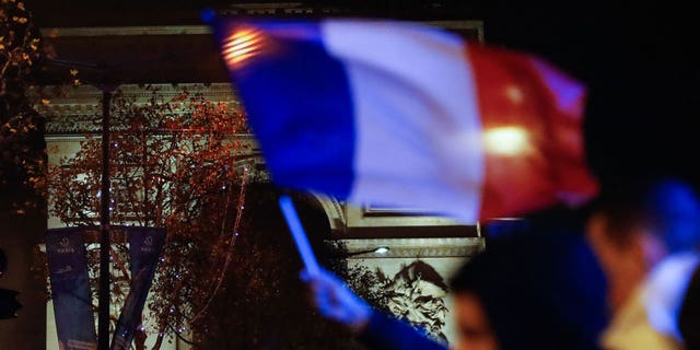 French fans celebrate a victory in the quarter-finals football match of the World Cup 2022 in Qatar between Morocco and France in a bar in Montpellier.  Later that evening, during the celebrations, a teenager was hit by a car and killed.  Police found the car, but the suspect fled the scene.