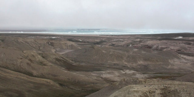 This 2006 photo provided by researchers shows the landscape at Kap Kobenhavn, Greenland. The many hills have been formed by rivers running toward the coast.