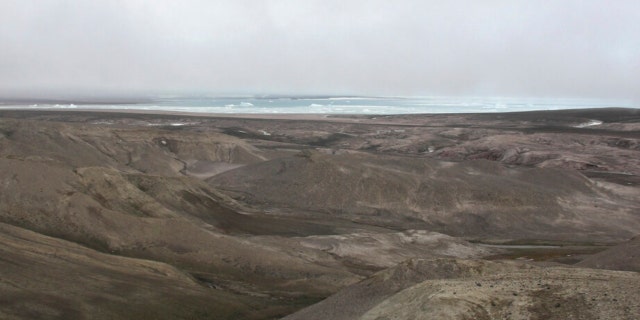 This 2006 photo provided by researchers shows the landscape at Kap Kobenhavn, Greenland. The many hills have been formed by rivers running toward the coast. 